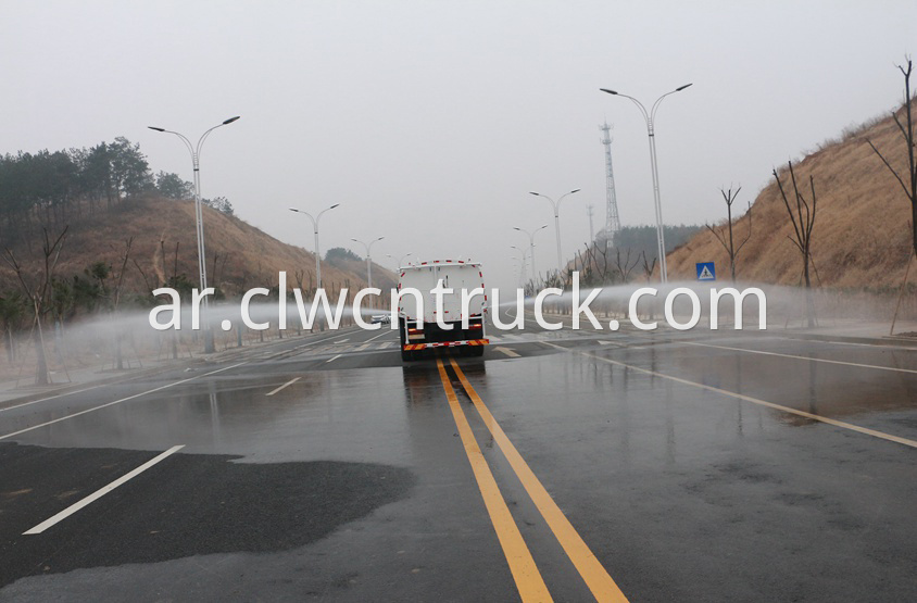 street water spray truck in action 2